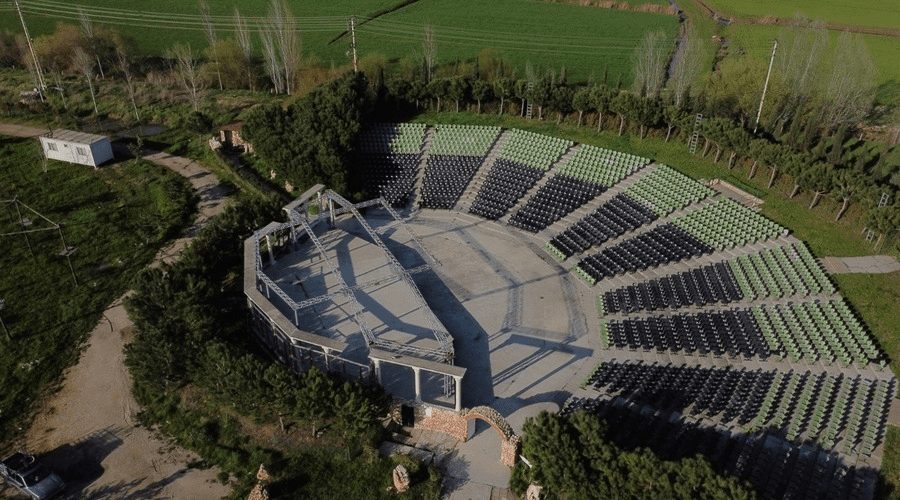 Aerial view of the open-air amphitheatre and its tiered seating